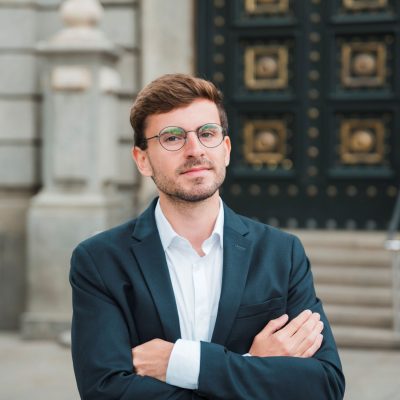 portrait-confident-young-businessman-with-his-arms-crossed